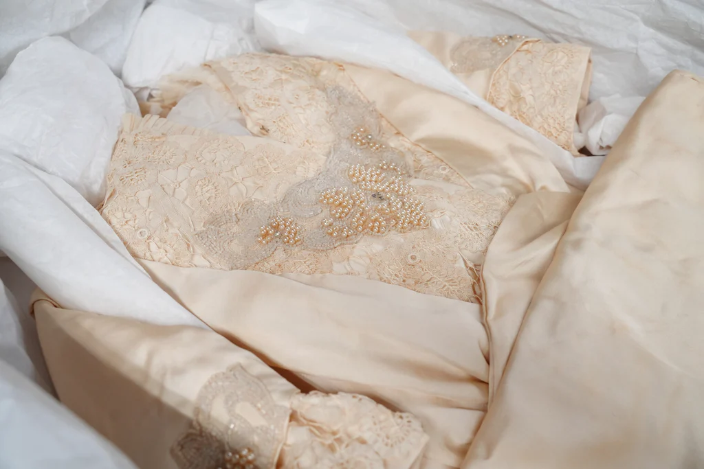 Details of the beading on the bodice of a cream silk and lace trimmed wedding gown, 1914, from the collections of The Charleston Museum. This dress was made by an African-American seamstress, Phoebe, who worked in Charleston in the early 20th century. It was worn by Wilhelmine Dorothea Meyer when she married Adolf Gevert Hollings on January 7,1914.
