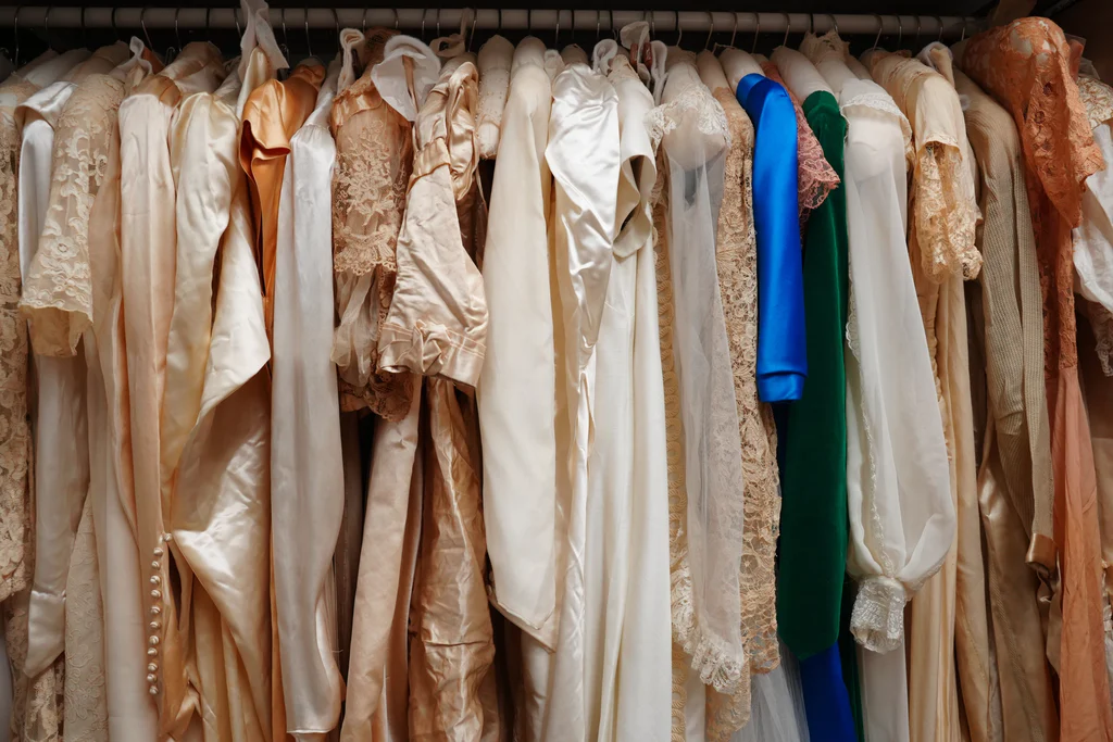 View of just one of three hanging cabinets filled with wedding dresses in the storeroom of The Charleston Museum.