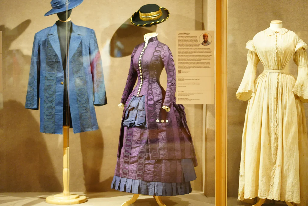 Purple and dark blue silk wedding gown, 1883, from the collections of The Charleston Museum. Made by Harriet Theresa Barrington Randall for her daughter, Caroline Amelia Randall, to wear for her wedding to William Rush Kelly on January 2, 1884, in Blackville, South Carolina.